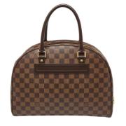 Pre-owned Brunbelagt lerret Louis Vuitton Nolita