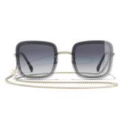 Stilige solbriller med svart metallramme og degradert filter
