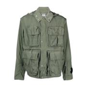 Grønn teknisk jakke med avtagbar hette og flere lommer
