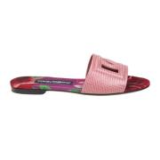 Rosa skinn sandaler kryssede logo
