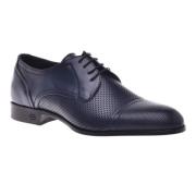 Lace-up in dark blue perforated calfskin