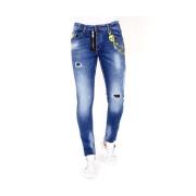 Slitte Jeans med Fargesprut - 1023