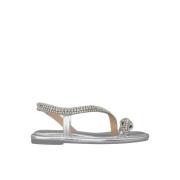 Flat sandal med slange stropp