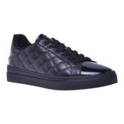 Trainers in black quilted leather and patent leather